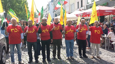 كلن ـ شعارهاي  (زنداني سياسي آزاد بايد گردد) در تظاهرات روزجهاني كارگر